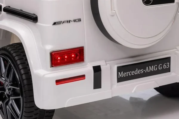 Kinderfahrzeug - Elektro Auto "Mercedes G63 AMG" - Lizenziert - 12V Akku,2 Motoren- 2,4Ghz Fernsteuerung, MP3+Ledersitz+EVA-Weiss – Bild 11